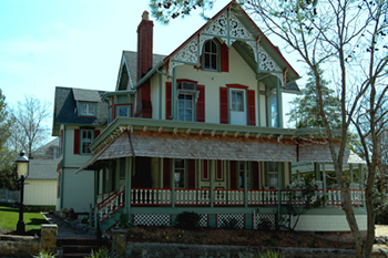 April 2006-restored to original colors with new cedar shakes on porch roof